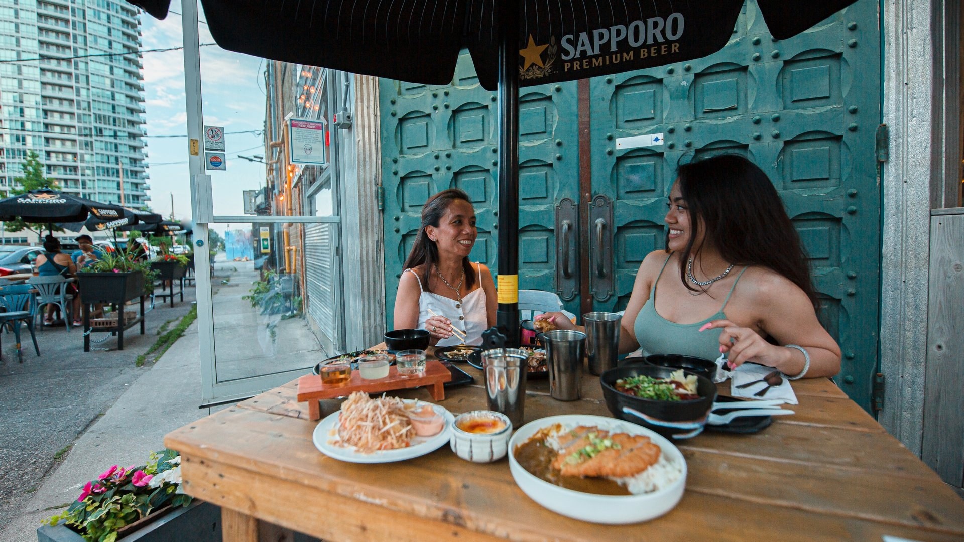 Me Nami patio people sharing meal daytime Food Drink Nightlife Image large
